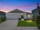 Charming single-Gathering home with a well-maintained lawn and a two-car garage at 13105 Fruitville Way, Riverview, FL 33579