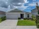 Charming single-Gathering home with a well-maintained lawn and a two-car garage at 13105 Fruitville Way, Riverview, FL 33579