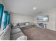 Comfortable living room featuring a large sectional sofa and mounted television at 13105 Fruitville Way, Riverview, FL 33579