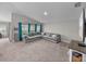 Spacious living room featuring an oversized sectional sofa and ample natural light at 13105 Fruitville Way, Riverview, FL 33579