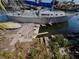 Exterior view of a sailboat on a canal with a broken dock at 13710 Frances Ave, Hudson, FL 34667