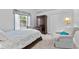 Cozy bedroom features a wooden sleigh bed, armoire, and chair, creating a relaxing retreat at 1553 Canopy Oaks Blvd, Palm Harbor, FL 34683