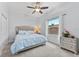 Comfortable bedroom featuring natural light, stylish decor, and a ceiling fan at 1553 Canopy Oaks Blvd, Palm Harbor, FL 34683