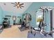 Bright home gym with updated fitness equipment, recessed lighting, and serene views at 1553 Canopy Oaks Blvd, Palm Harbor, FL 34683