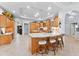 A chef's dream kitchen with a large island, seating, custom cabinets, and modern fixtures creating an inviting culinary space at 1553 Canopy Oaks Blvd, Palm Harbor, FL 34683