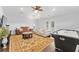 Entertaining room features seating, air hockey, and French doors to backyard at 1553 Canopy Oaks Blvd, Palm Harbor, FL 34683