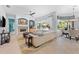 Bright and airy living area featuring fireplace, pool view, and comfortable seating making for a relaxing atmosphere at 1553 Canopy Oaks Blvd, Palm Harbor, FL 34683