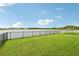 Back yard with a view of a lake, offering a serene and picturesque outdoor setting at 15825 Mauvewood Ave, Odessa, FL 33556