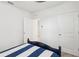 Bedroom featuring carpet flooring and two doors that lead to other rooms at 15825 Mauvewood Ave, Odessa, FL 33556