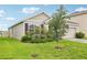 Charming single-Gathering home with a well-maintained lawn and colorful flowering shrubs at 15825 Mauvewood Ave, Odessa, FL 33556