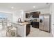 Modern kitchen with stainless steel appliances, granite countertops, and a convenient island at 15825 Mauvewood Ave, Odessa, FL 33556