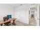 Bright home office featuring a door and view into an adjoining room at 15825 Mauvewood Ave, Odessa, FL 33556