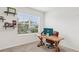 Bright home office with a large window, stylish desk, and comfortable chair at 15825 Mauvewood Ave, Odessa, FL 33556