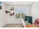 Bright home office with a large window, stylish desk, and comfortable chair at 15825 Mauvewood Ave, Odessa, FL 33556