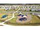 Aerial view of a playground in the center of a Gathering friendly community at 15825 Mauvewood Ave, Odessa, FL 33556