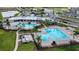 Community pools surrounded by lush landscaping, offering a resort-like atmosphere for residents at 15825 Mauvewood Ave, Odessa, FL 33556
