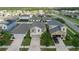 Aerial view showcases a well-planned neighborhood with lush landscaping, manicured lawns, and a sense of community at 17156 Yellow Pine St, Wimauma, FL 33598
