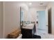 Bathroom featuring a sink, granite countertop, and access to the laundry room at 17156 Yellow Pine St, Wimauma, FL 33598