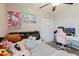 Bedroom with a ceiling fan, Hello Kitty, Cinnamoroll, desk and pink gaming chair at 17156 Yellow Pine St, Wimauma, FL 33598