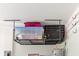 Overhead garage storage provides optimal organization at 17156 Yellow Pine St, Wimauma, FL 33598