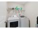 Functional laundry room featuring a washer and dryer for added convenience at 17156 Yellow Pine St, Wimauma, FL 33598