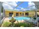 A screened pool area with a spa and patio space at 17807 Fallowfield Dr, Lutz, FL 33549