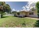Backyard with patio and grassy area at 1868 Lombardy Dr, Clearwater, FL 33755