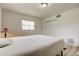 Neat bedroom featuring a bed, closet, and window with blinds at 1868 Lombardy Dr, Clearwater, FL 33755