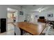 Open floor plan with view of kitchen and dining area with neutral decor at 1868 Lombardy Dr, Clearwater, FL 33755