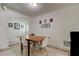 Bright dining room features a tile accent floor and modern decor on the wall at 1868 Lombardy Dr, Clearwater, FL 33755