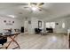This living room features light wood flooring, a ceiling fan and is nicely decorated at 1868 Lombardy Dr, Clearwater, FL 33755
