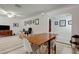 Open concept living space with dining area featuring art and modern decor at 1868 Lombardy Dr, Clearwater, FL 33755