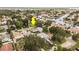 Overhead view of quiet residential area with lush greenery, calm waterways, and houses with well-kept lawns at 1882 Maryland Ne Ave, St Petersburg, FL 33703
