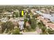 Aerial view of a residential neighborhood with mature trees and well-maintained lawns in a waterfront community at 1882 Maryland Ne Ave, St Petersburg, FL 33703