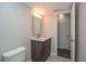 Bathroom with a vanity and a light fixture. The walls are painted in light grey at 1882 Maryland Ne Ave, St Petersburg, FL 33703