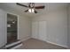 Clean bedroom with carpeted floors, a ceiling fan, and closet with sliding doors at 1882 Maryland Ne Ave, St Petersburg, FL 33703