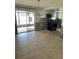 Dining area featuring tile flooring, a modern light fixture, and sliding glass doors to the patio, some remodeling in progress at 1882 Maryland Ne Ave, St Petersburg, FL 33703