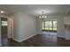 Dining area with access to other rooms and access to a screened patio area with nice light fixture at 1882 Maryland Ne Ave, St Petersburg, FL 33703