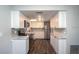 Updated kitchen features white cabinets, stainless steel appliances, and marble countertops at 1882 Maryland Ne Ave, St Petersburg, FL 33703
