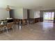 Open living space with tile flooring, access to a screened patio, and some remodeling in progress at 1882 Maryland Ne Ave, St Petersburg, FL 33703