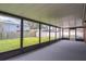 Screened in patio overlooking a well-maintained lawn and a white storage shed at 1882 Maryland Ne Ave, St Petersburg, FL 33703