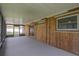 Spacious screened patio with wood paneling and ample room for outdoor entertaining and relaxation at 1882 Maryland Ne Ave, St Petersburg, FL 33703
