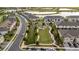 A lovely aerial view of the neighborhood amenities, including a community space with green spaces and manicured landscaping at 19272 Blue Pond Dr, Lutz, FL 33558