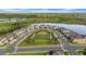 Neighborhood park with landscaped green spaces surrounded by well-manicured homes near a pond at 19272 Blue Pond Dr, Lutz, FL 33558