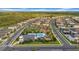 Aerial view featuring a community pool with clubhouse, park, and green spaces in the neighborhood at 19272 Blue Pond Dr, Lutz, FL 33558