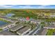 Beautiful aerial view of lakeside townhomes with manicured landscaping and community park at 19272 Blue Pond Dr, Lutz, FL 33558