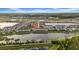 Overhead view showcasing lakeside townhomes with well-maintained landscaping and lakefront views at 19272 Blue Pond Dr, Lutz, FL 33558