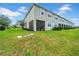 Spacious backyard with a screened-in patio, perfect for outdoor enjoyment and entertaining at 19272 Blue Pond Dr, Lutz, FL 33558
