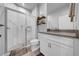 Bright bathroom features a large shower with glass doors and modern vanity at 19272 Blue Pond Dr, Lutz, FL 33558
