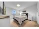 Cozy bedroom with natural light, a comfortable bed, and neutral colors, creating a relaxing retreat at 19272 Blue Pond Dr, Lutz, FL 33558